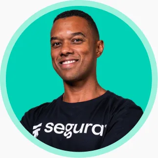 Smiling professional wearing a Segura™ T-shirt