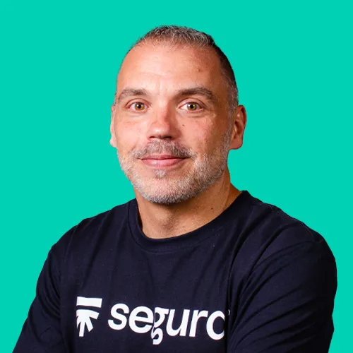 Smiling Segura™ specialist wearing a Segura™ T-shirt