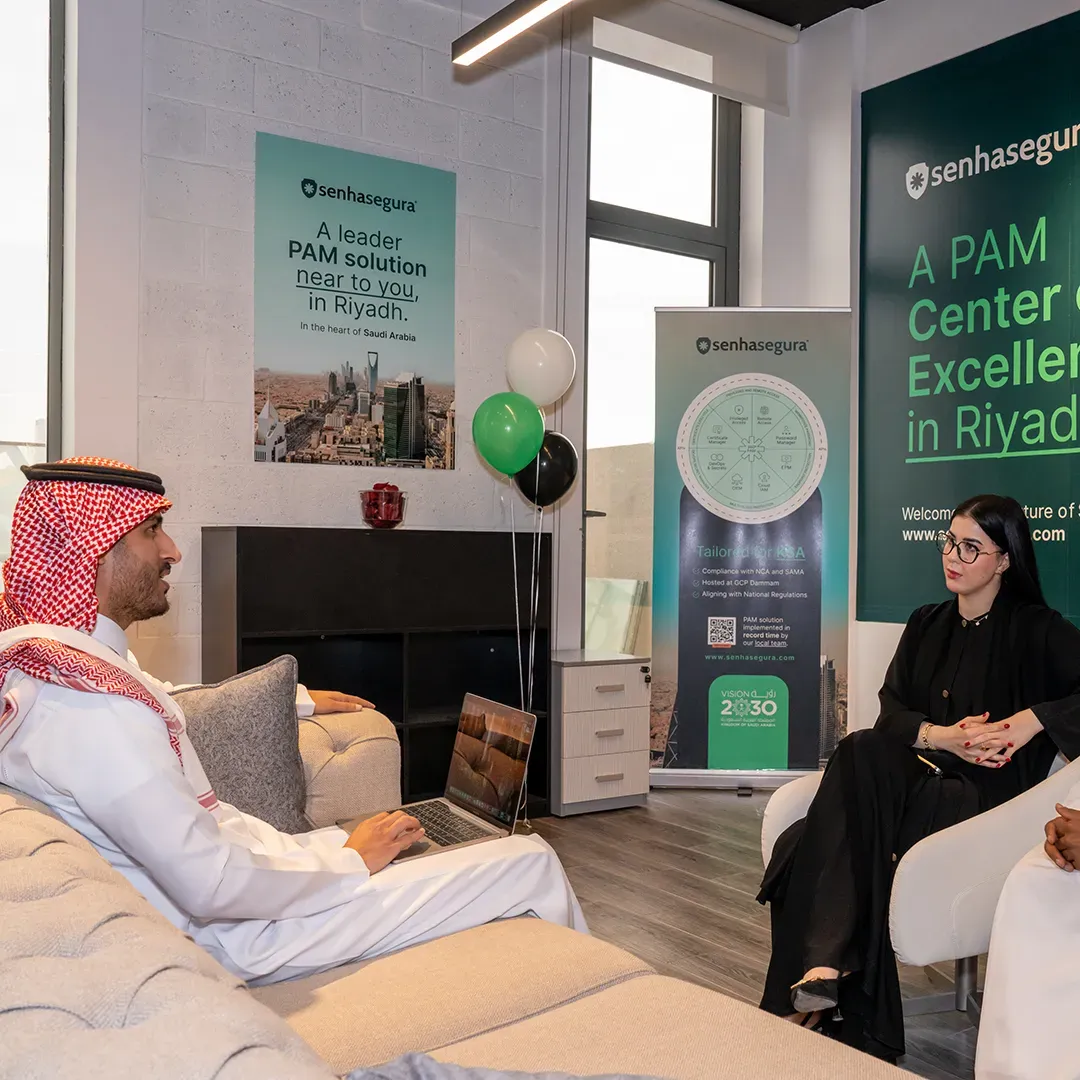 Professionals talking in the lounge area of the Riyadh Center of Excellence