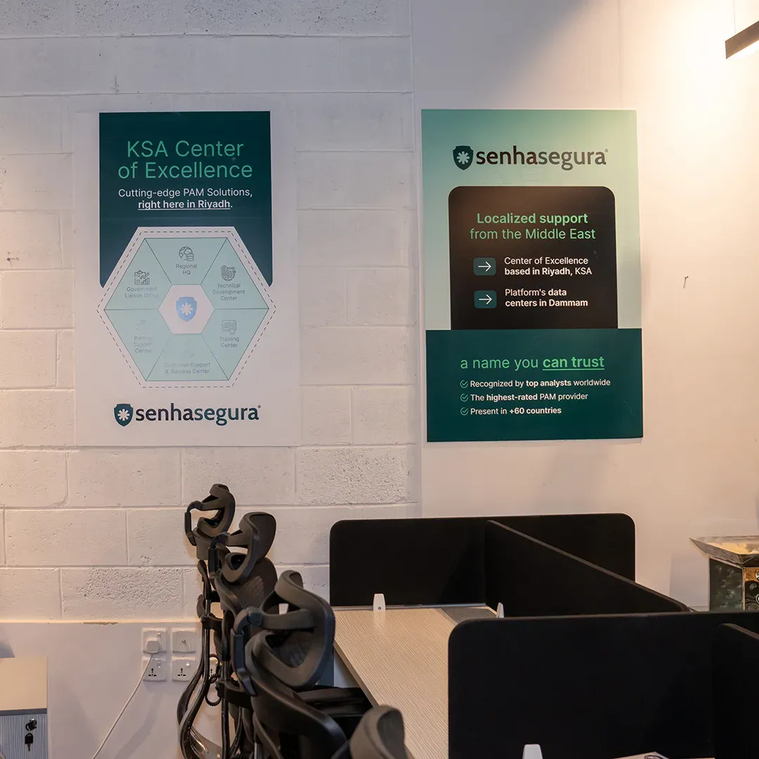 Posters about the KSA Center of Excellence and local support above the workstations