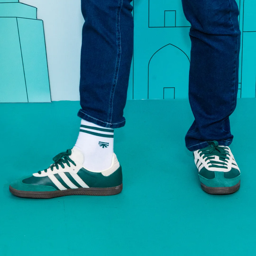 Green Adidas Samba sneakers worn with Segura™ socks