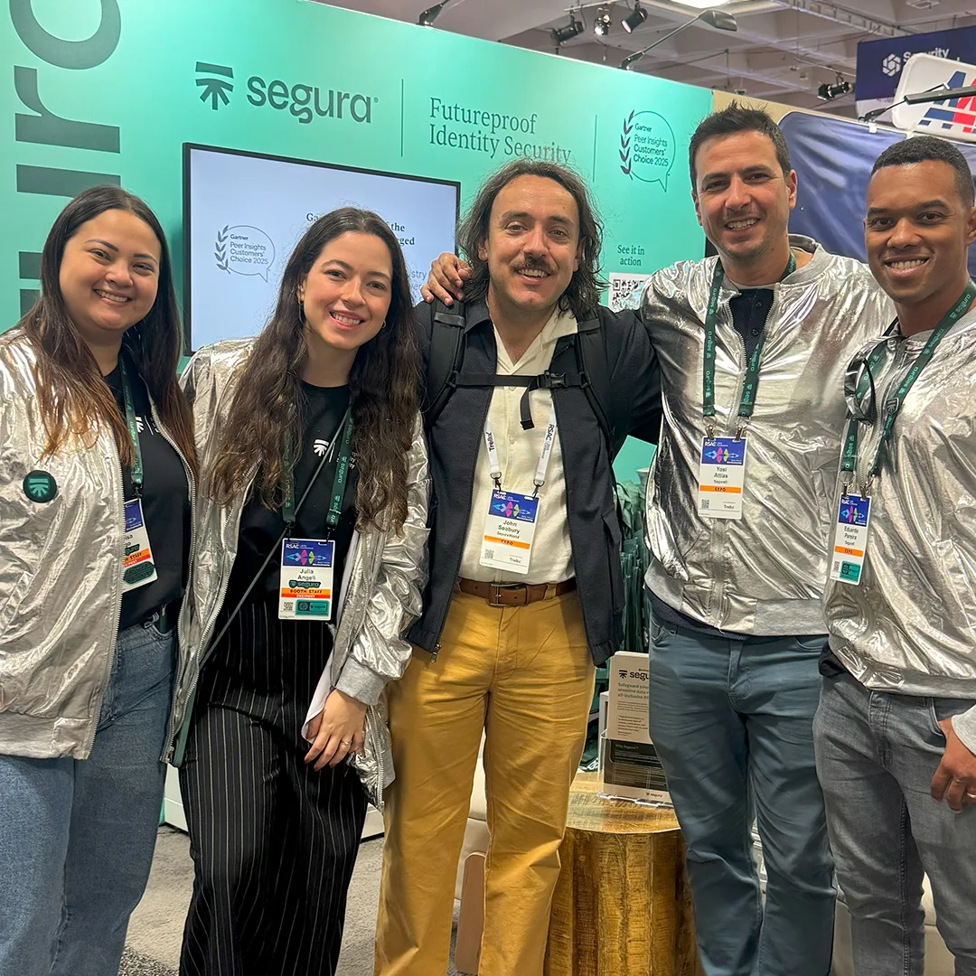 Segura™ team posing together at their event booth