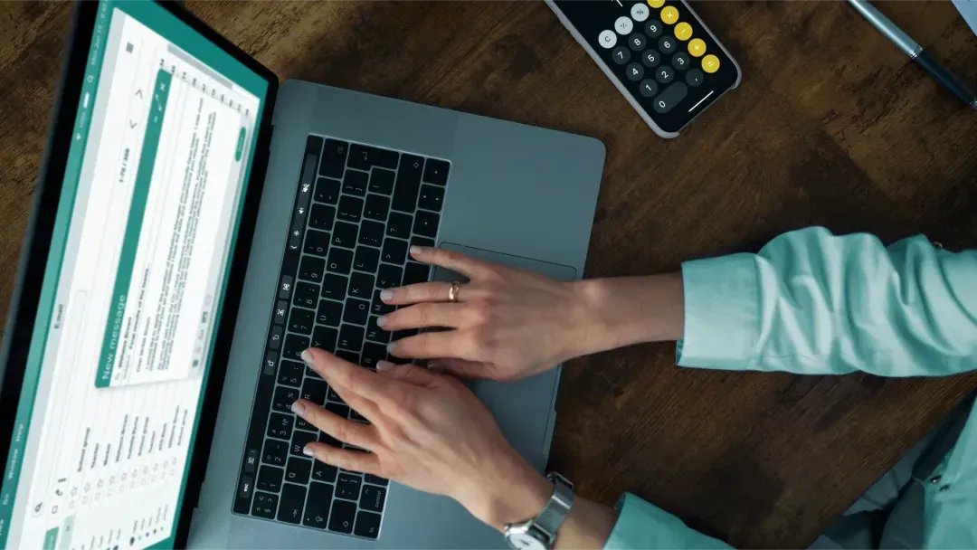 Person typing on a laptop
